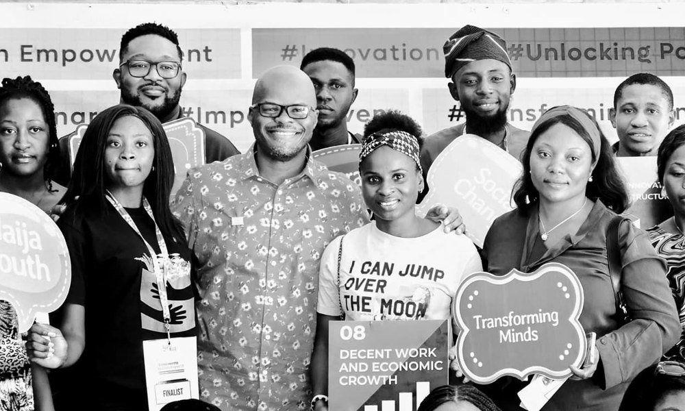 Mobolaji with finalists at a 234 Project youth program