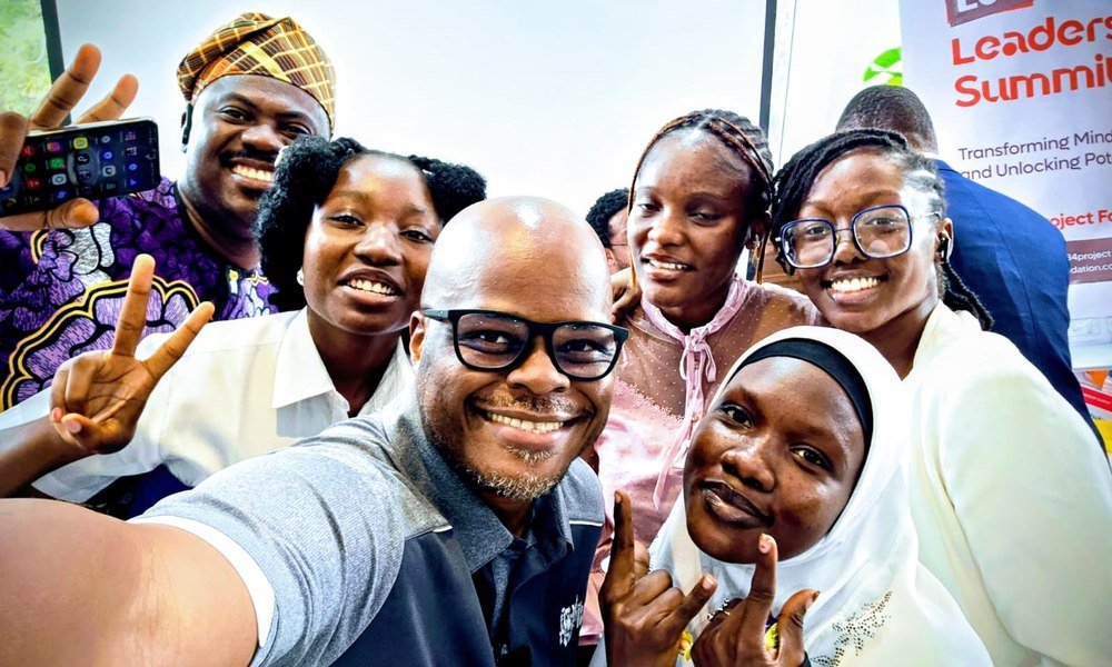 Mobolaji with student finalists at the 234 Leadership Summit