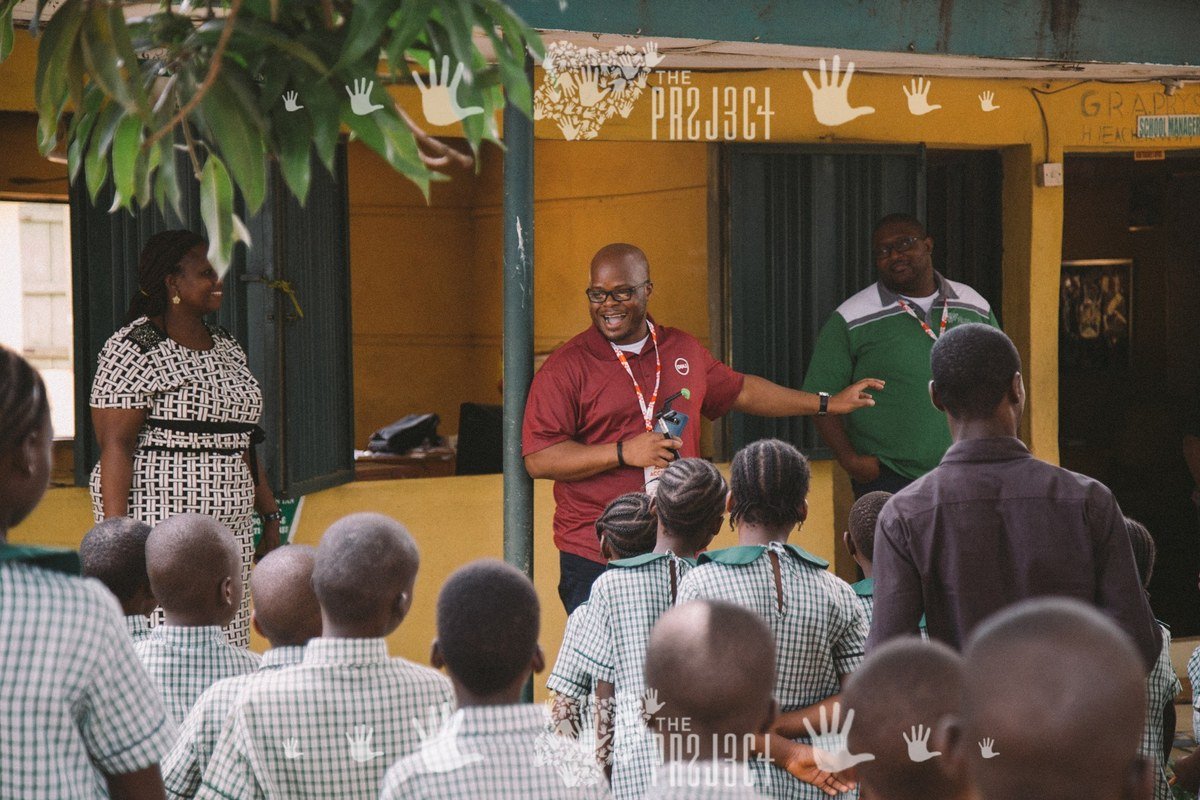 Mobolaji with pupils at a Lagos primary school for The 234 Project