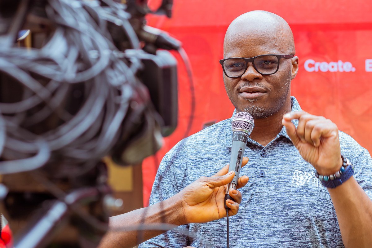 Mobolaji interviewed on camera at a 234 Project event