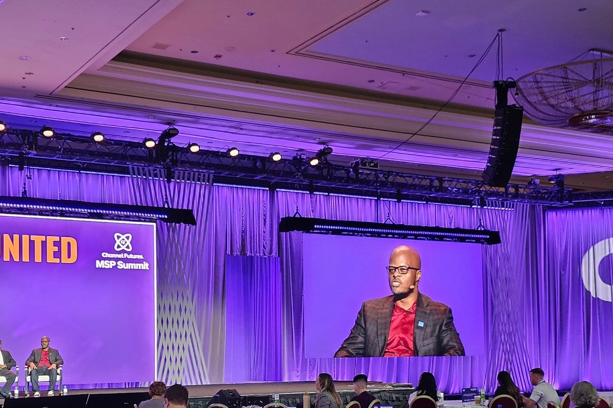 Mobolaji on the main stage at the Channel Futures MSP Summit
